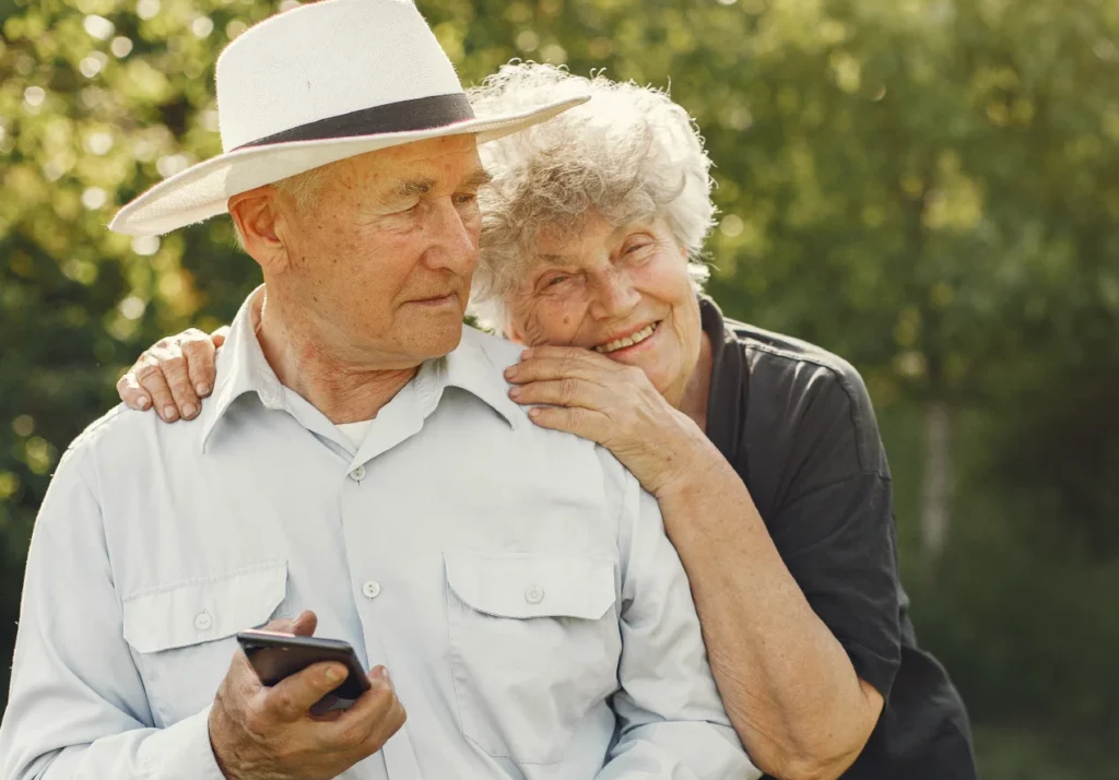 Senior couple enjoying a walk outside in nautre.